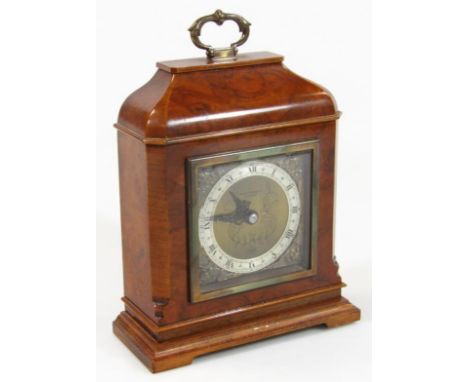 An Elliott walnut veneer mantel clock, retailed by Pearce & Sons, Leicester, in shaped case with decorative 8cm dia. chapter 