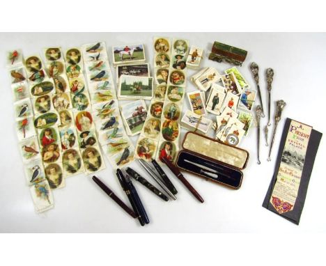 A set of 19thC brass sovereign scales, various silver mounted button hooks, silk cigarette and chewing gum cards, Parker and 
