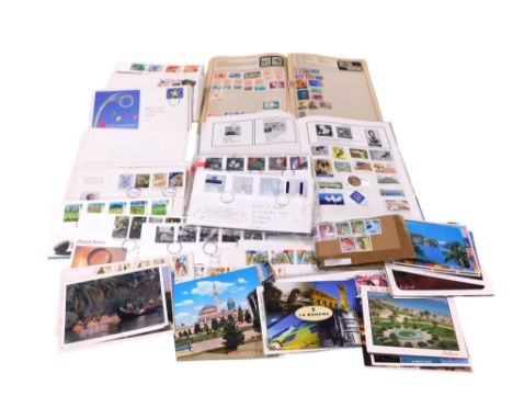 Philately. Postage stamps, GB first day covers, and an accumulation of world stamps, chiefly used, in three stock books and l