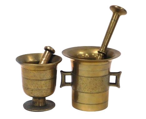 An early 20thC brass pestle and mortar, mortar 12cm high, and a further pestle and mortar, mortar 10.5cm high. (2)