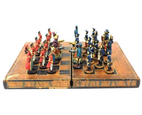 A plaster pirates and Royal Navy chess set, in an Artunner Ltd leather book form fold over chessboard box, military issue 194
