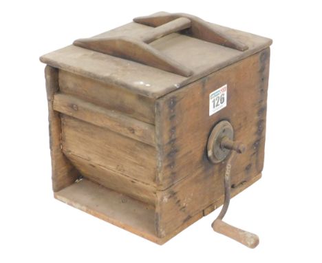 A vintage pine butter churn, of rectangular box form, with a cast iron handle, 47cm wide