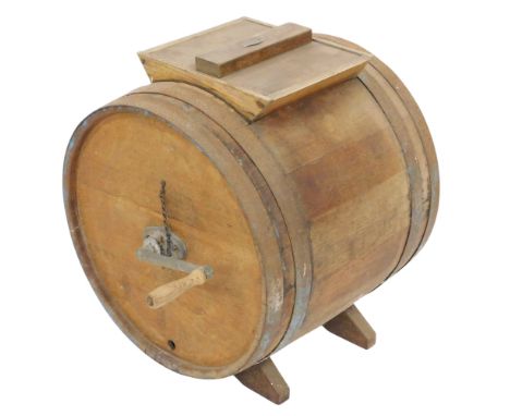 A vintage oak butter churn signed R A Lister &amp; Co Ltd, Dairy Engineers, Dursley, of barrel form, with a metal handle, 47c