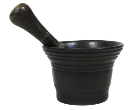 A 19thC bronze pestle and mortar, mortar 9cm wide.