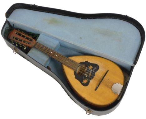 An Italian mandolin, with a rosewood fret board, the body with floral inlay, cased. 