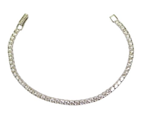 A Crislu silver and cz tennis bracelet, on a snap clasp, cased, 18cm long.