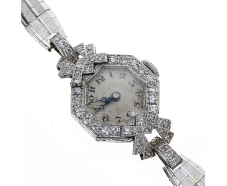Platinum and diamond 1920s lady's cocktail watch, octagonal engine turned silvered dial with Arabic numerals, round brilliant