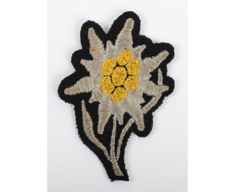 WW2 Waffen-SS Mountain Troops M-43 Cap Insignia, good un-issued example of the Dachau made M-43 Edelweiss insignia for the mo