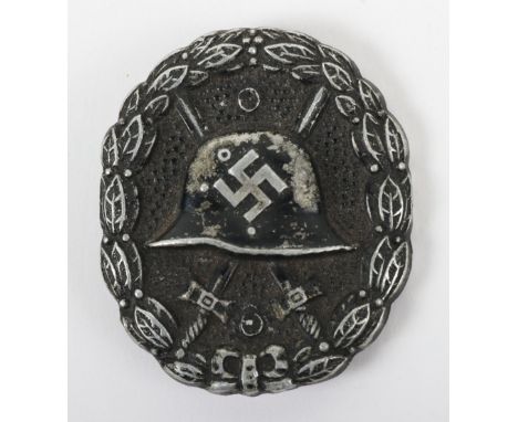 Scarce Condor Legion 1936 Pattern Black Grade Wound Badge, the award has the WW1 M-16 style helmet to the centre. Much of the