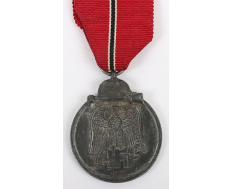 WW2 German Eastern Front Medal by Richard Simm &amp; Sohne, good zinc example with its original ribbon and the ring is stampe