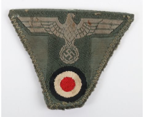 WW2 German “T” Shaped M-43 Cap Eagle, fine cap removed example with the remains of the cap backing to the reverse. The “T” sh