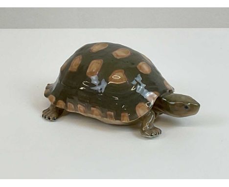 ROYAL COPENHAGEN; a porcelain figure of a tortoise, printed and painted marks to the base with model 552, date mark 1898-1923