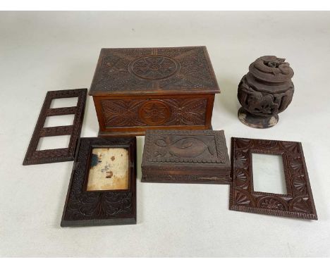 A circa 1900 carved oak box, three similarly carved photograph frames, an Eastern carved trinket box and an Eastern carved ci