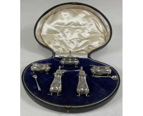 A cased George V hallmarked silver cruet comprising lidded mustard, pair of oval salts and pair of pepperettes with three ass