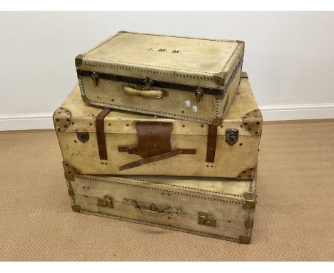 An early 20th century vellum travel trunk with leather straps, height 32cm, width 83cm, depth 49cm, and an early 20th century