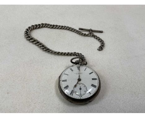 A silver open faced key wind pocket watch, inscribed 'J. W. Benson, London' to the white enamel dial, suspended on a graduate