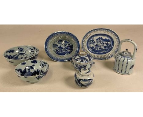 A group of Chinese blue and white ceramics including two dragon decorated graduated bowls, a chestnut basket on stand, circul