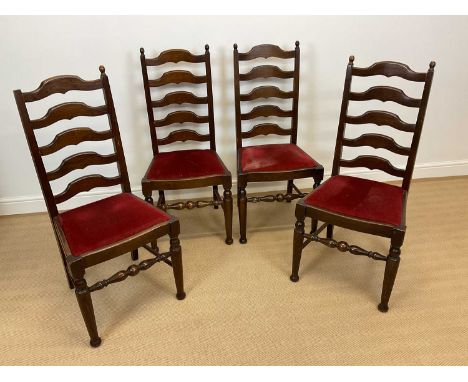 Four oak ladder back dining chairs with upholstered drop-in seats.