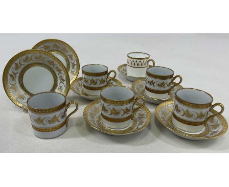 RICHARD GINORI; five gilt heightened coffee cans, six saucers and a further associated coffee can.   Condition Report: Some g