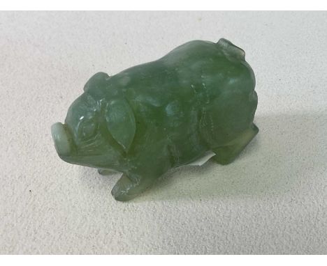 A Chinese carved jade figure of a pig, length 7.5cm.