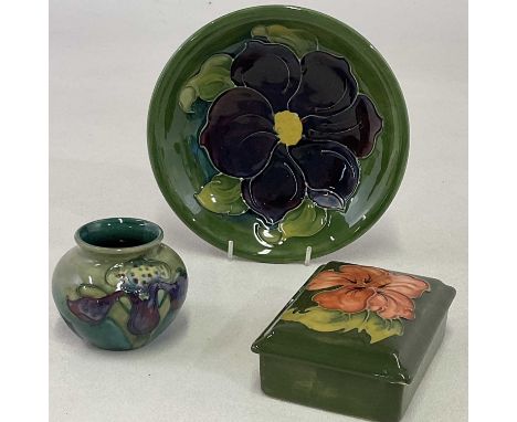 MOORCROFT; a squat green ground posy vase in 'Orchid' pattern, with impressed marks, height 6.5cm, a green ground trinket box