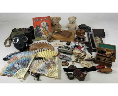 A collectors' lot to include military items, Naval buttons and badges, prismatic compass in case, gas mask, binoculars and a 