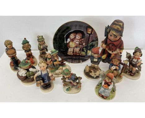 GOEBEL AND HUMMEL; a collection of thirteen figures.Condition Report: No visible signs of cracks,grazing or restoration