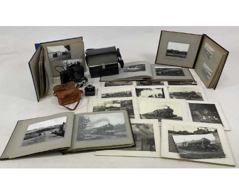 Four photograph albums containing photos of mainly steam locomotives, together with a Polaroid camera and a VP twin camera an