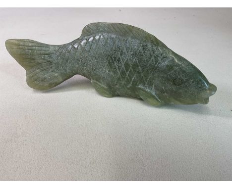 A large Chinese carved jade model of a fish, length 25cm.