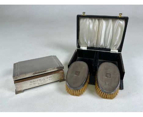A George VI hallmarked silver twin section cigarette box of Art Deco stepped design, with presentation inscription 'Lt. Col. 