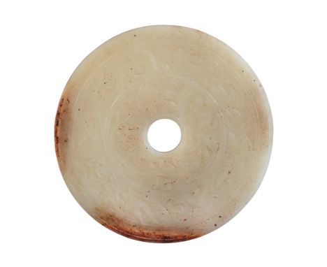 A CHINESE WHITE JADE BI DISC carved with two registers of phoenix, lions and other beasts within an outer scroll border, the 