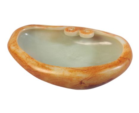 A CHINESE JADE BOWL OF MASSIVE PROPORTIONSthe base with an extensive mark, incised into the the stone, highlighted in gilt, 7