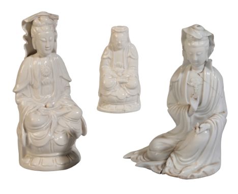 THREE CHINESE BLANC DE CHINE FIGURES OF GUANYIN 19th century or later, all in seated contemplative pose, two with orbs in the