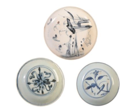 THREE CHINESE BLUE AND WHITE VESSELS the first, a Ming dish decorated with a scrolling flowerhead, 11cm diameter, the second 