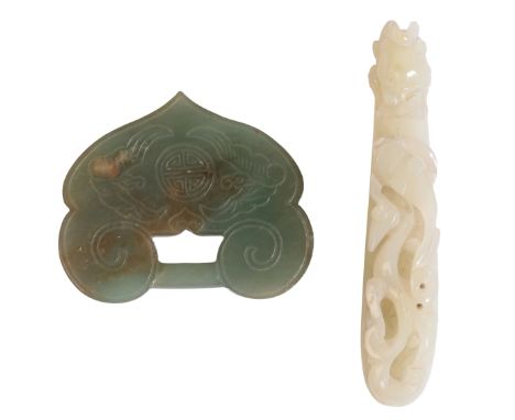 A CHINESE JADE BELT HOOK in Han style, carved to the façade with a chilong,10cm long; together with a Jade buckle, Qing dynas