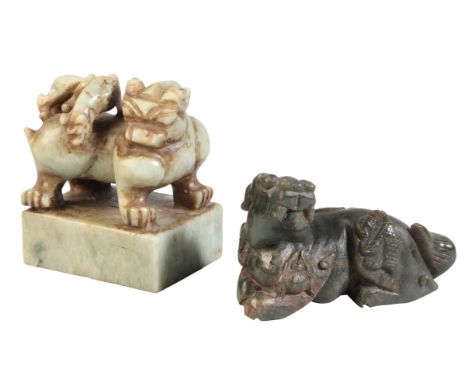 A CHINESE CARVED SOAPSTONE CHILONGfigured recumbent, the body adorned with 'The Five Poisons', 12cm wide; together with a car