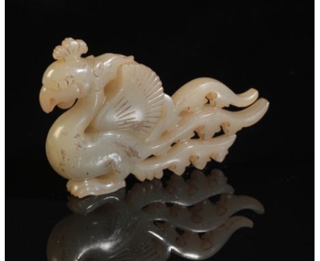 A CHINESE GREY-GREEN JADE PHOENIX Ming or later, with carved plumage, 9.5cm longProvenance: A private French collection.