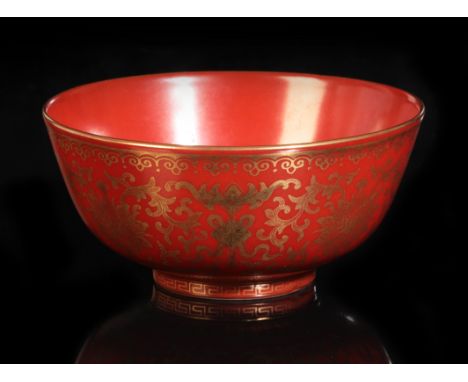 A CHINESE CORAL-RED GLAZED BOWLbearing six character Qianlong seal mark to the base and probably of the period, decorated in 