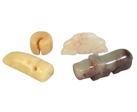 AN ARCHAISTIC CHINESE CARVED JADE PENDANTin the form of the head of a mythical beast, 5.5cm wide; together with a pale green 