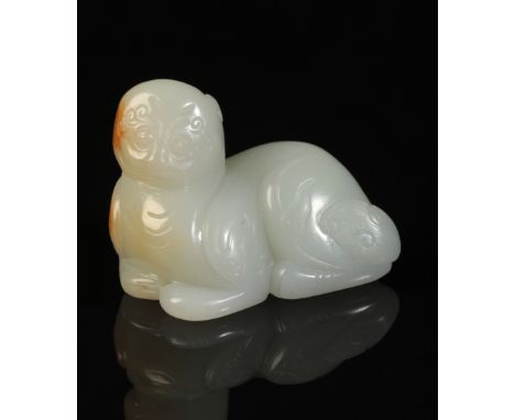 A CHINESE PALE CELADON JADE KYLINthe stone with a soft lustrous polish and rust-coloured mottling to the face and back, 6.5cm