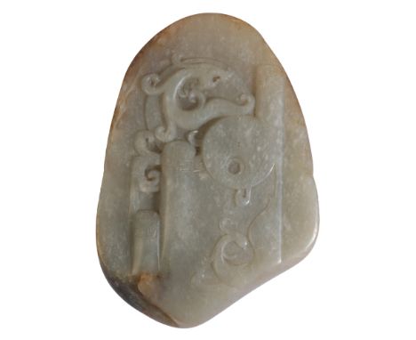 A CHINESE JADE CARVINGof naturalistic form, decorated in relief with a chilong and scrolls, 10cm high