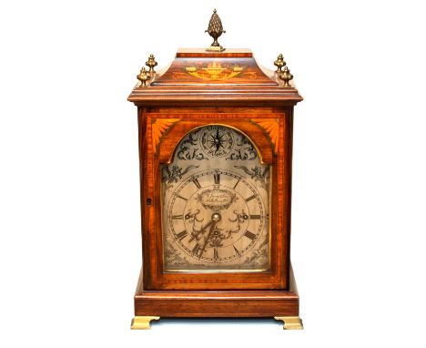 An Edwardian mahogany and inlaid bracket clock, George Jones and Sons, quarter striking, the 7 inch silvered dial with Roman 