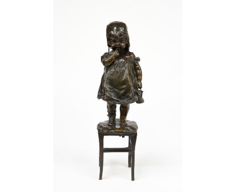 Clara, Juan (Spanish) (1875-1957), a bronze study of a timid child standing on a stool holding her boot in hand, signed, all 