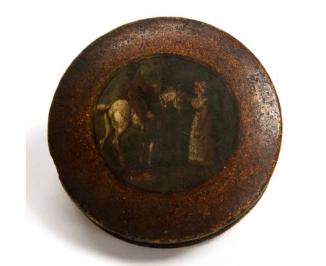 An early 19th century papier mache snuff box, circular form, the central painting of a man on horseback with a woman standing