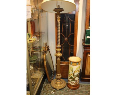 An early 20th century giltwood carved standard lamp, 180cm high