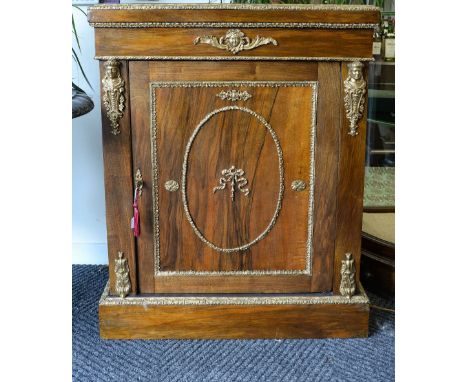 A French mid 19th century rosewood and ormolu mounted side cabinet, with ormolu beading and Classical mounts, the single door