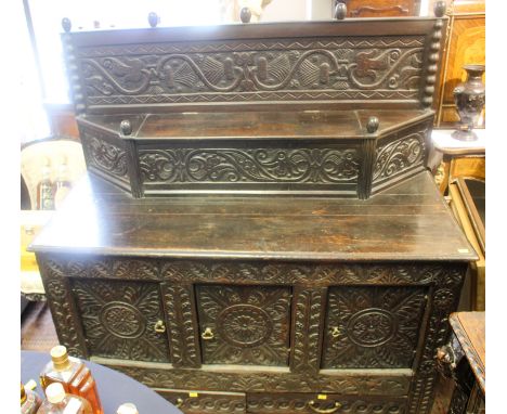A late 17th century and later chest, converted at a later date to a side cupboard, fitted with an upper section having a hing
