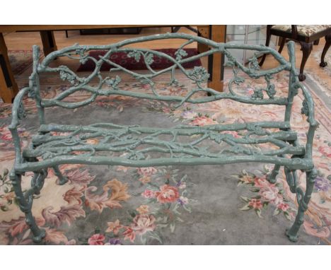 A late 19th century cast iron garden bench, attributable to Coalbrookdale, in a naturalistic form, with an iron seat, 85cm hi
