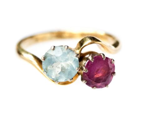 A ruby and aquamarine crossover ring, claw set round cut stones, 18k shank 