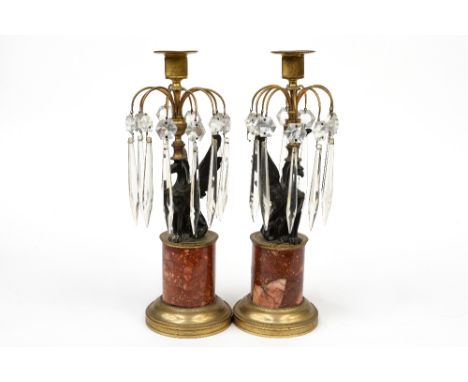 A pair of candlestick lustres, French late 19th Century, ormolu with bronze sphinx stems mounted on rouge marble cylindrical 